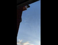 Collab DailyDoseOfInternet - Two airplanes smoke lines morning blue sky