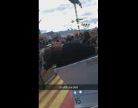 lady black sweater past out on fair ride