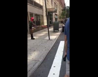 Guy pokes metal pole with red lightsaber 