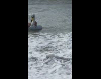 Collab Kook Of The Day - man in swan floaty flipped in wave