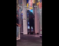 Man pisses on cup throws to vendor