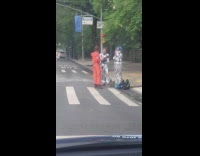 three guys in astronaut costumes street