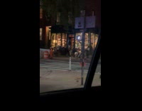 Man dragon costume and thong dance street night