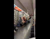 Collab Subway Creatures - Man in spiderman mascara climbing on train railings