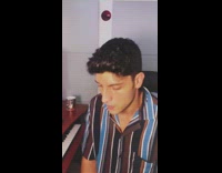 Guy wearing striped shirt sings cover 