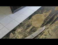 Water covered in sawdust liquid solid knife 