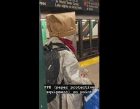 Brown paper bag over head guy subway 