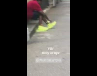 Red shirt guy spray paints shoes yellow 