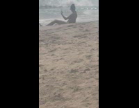 Woman bikini lie down selfie beach waves Part 2