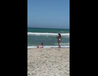 Woman onesie lay on beach ice cart