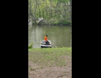 Guy dances on small rowboat 