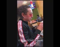 Guy eats Popeyes chicken sandwich gets on chair in restaurant and says its good