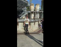 Guy looking back at grey star wars ship