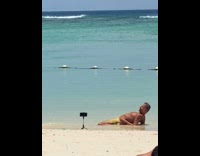 Collab IITW - Man shirtless lie down at beach shore