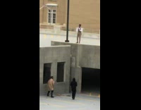 guy graduation cap parking lot