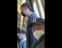 Train passenger matches photo on phone 