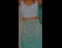 Girl shows outfit and accessories brown bag