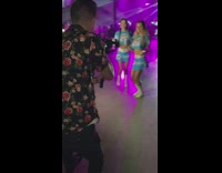 Two girls in bang outfits dance 