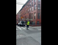 Collab WINY - Man reflective green vest lift metal barricade workout crosswalk