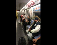 Man subway with iguana lizard on head blue hat