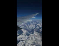 Plane flight view fly over Himalayas mountains
