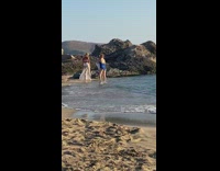 Woman bikini transparent skirt pose at beach