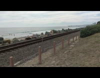 Woman says excuse me with XQZ signage