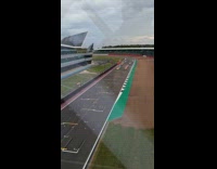 Ferrari race car seen from glass bridge