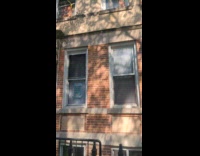 Apartment building with competing signs