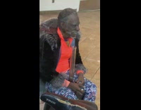 Homeless man sits inside bank of america ATM room and smokes weed out of bong 