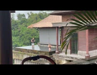 Woman black bikini poses in the pool