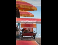 Woman enjoying beach chair with canopy shade 