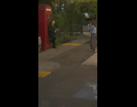 Girl stripe skirt red phone booth guy book