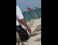 Two women in bikini take turns on the beach swing Part 3