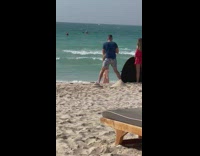 Woman bikini kneel beach friends hold reflector part 1
