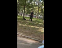 Guy Watches Man Doing Martial Arts at Park 
