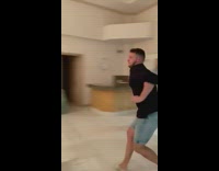 Guy jumps over railing onto couch does scorpion 