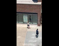 Collab WINY - Woman dance in front of for lease store window