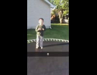 Slow motion throwing water cooler container at little boy trampoline kid