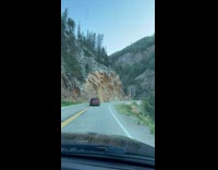 Red SUV almost hits cars on road