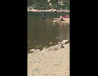 Woman hula hoop dance riverside video shoot