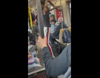 Guy shows exhibition of his flexible arms at train 