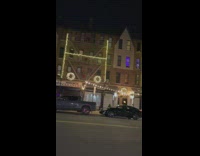 Christmas lighting fixtures on building that spell HO