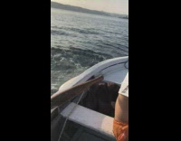 Guy tries to jump off boat slips 