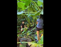 Man black shirt spread mud arms forest