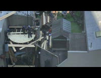Tenant watches construction on apartment rooftop 
