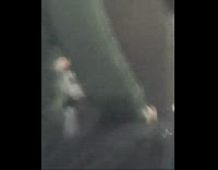 Green sweater guy brushes pants off bus