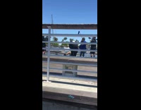 Lady in white twerks on a pier 