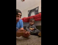 Baby react to dad light a match stick
