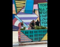 Collab IITW - Three women tiktok dance graffiti wall behind